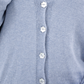 Close-up of the Jasmin cotton cardigan in Cielo blue with flower-shaped mother-of-pearl buttons
