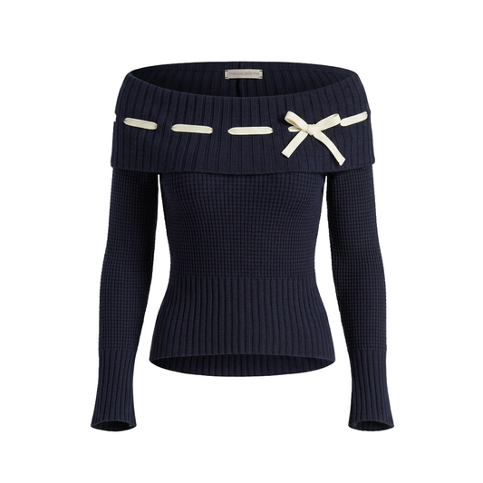 dark blue off-shoulder top with gold accents on a plain background
