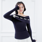 Model wearing the Lisette navy merino off-shoulder top with white ribbon detail and elongated sleeves, front view