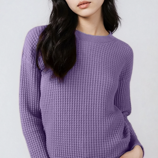 Person wearing a purple textured sweater against a white background