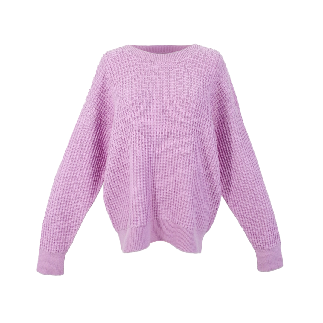 An oversized waffle-knit sweater with a round neckline and long sleeves. It is a cool light-mid pink color.